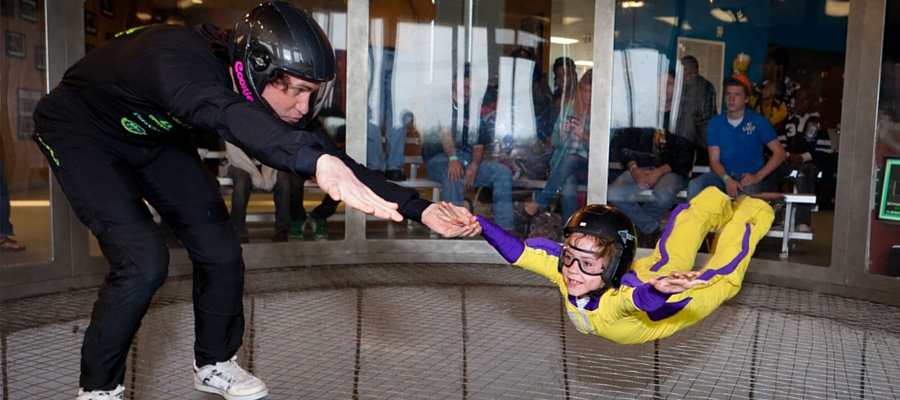 young child indoor skydiving in Paraclete XP wind tunnel with coach