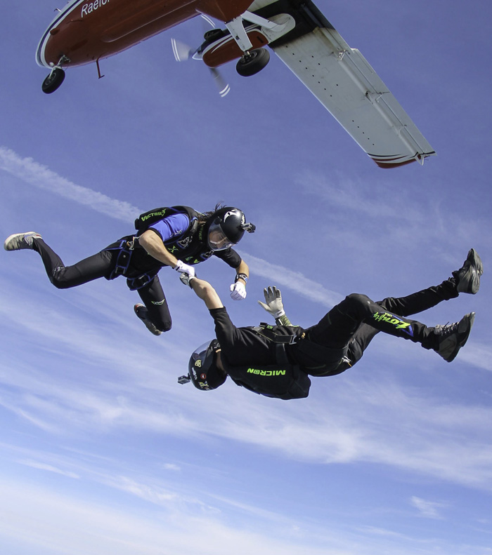 Mike Brewer and team member exits a skydiving plane