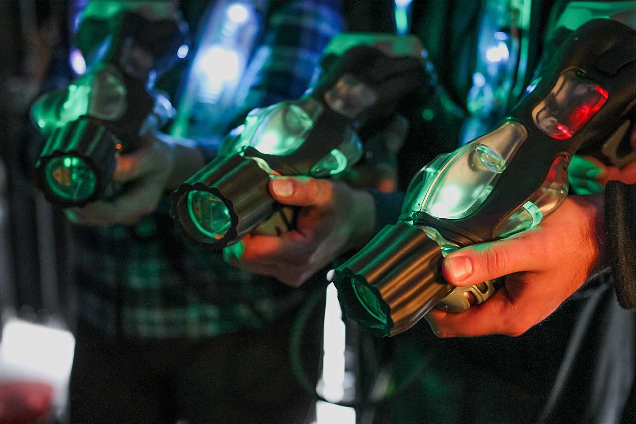 players holding laser tag guns